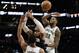 Houston Rockets guard Russell Westbrook, center, has his shot blocked by San Antonio Spurs forward Rudy Gay (22) during the first half of an NBA basketball game in San Antonio, Tuesday, Dec. 3, 2019. (AP Photo/Eric Gay)