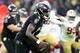 BALTIMORE, MARYLAND - DECEMBER 01: Quarterback Lamar Jackson #8 of the Baltimore Ravens runs with the ball against the San Francisco 49ers in the first half at M&T Bank Stadium on December 01, 2019 in Baltimore, Maryland. (Photo by Rob Carr/Getty Images)