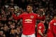 MANCHESTER, ENGLAND - DECEMBER 04: Marcus Rashford of Manchester United celebrates after scoring a goal to make it 2-1 during the Premier League match between Manchester United and Tottenham Hotspur at Old Trafford on December 4, 2019 in Manchester, United Kingdom. (Photo by Matthew Ashton - AMA/Getty Images)