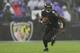 BALTIMORE, MARYLAND - DECEMBER 01: Quarterback Lamar Jackson #8 of the Baltimore Ravens rushes against the San Francisco 49ers during the third quarter at M&T Bank Stadium on December 01, 2019 in Baltimore, Maryland. (Photo by Patrick Smith/Getty Images)