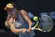 Caroline Wozniacki of Denmark hits a return shot against Katerina Siniakova of the Czech Republic during their third round of the women's singles match in the China Open tennis tournament at the Diamond Court in Beijing, Thursday, Oct. 3, 2019. (AP Photo/Andy Wong)