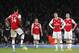 Players of Arsenal stand in the circle after Brighton's Neal Maupay scored his sides second goal during their English Premier League soccer match between Arsenal and Brighton, at the Emirates Stadium in London, Thursday, Dec. 5, 2019. (AP Photo/Frank Augstein)