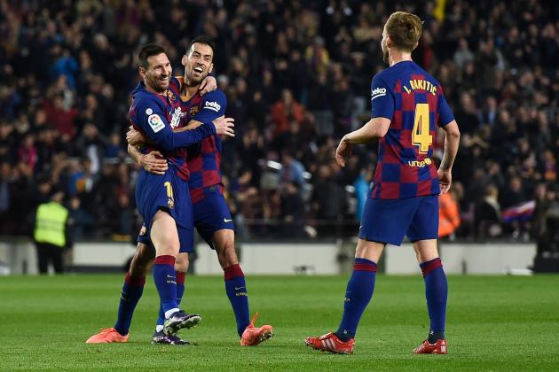 Barcelona's Argentine forward Lionel Messi (L) celebrates with teammates after scoring his team's second goal during the Spanish League football match between FC Barcelona and RCD Mallorca at the Camp Nou stadium in Barcelona on December 7, 2019. (Photo by Josep LAGO / AFP) (Photo by JOSEP LAGO/AFP via Getty Images)