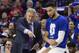 Philadelphia 76ers' head coach Brett Brown, left, talks things over with Ben Simmons, right, during the first half of Game 4 of a second-round NBA basketball playoff series against the Toronto Raptors, Sunday, May 5, 2019, in Philadelphia. Raptors won 101-96. (AP Photo/Chris Szagola)