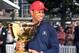 US golfer and captain of the US Presidents Cup team Tiger Woods holds the trophy at a press conference in Melbourne on December 6, 2018, one year ahead of the 2019 edition to be held at the Royal Melbourne Golf Club. (Photo by William WEST / AFP) / -- IMAGE RESTRICTED TO EDITORIAL USE - STRICTLY NO COMMERCIAL USE -- (Photo credit should read WILLIAM WEST/AFP via Getty Images)