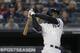 New York Yankees' Didi Gregorius follows through on a grand slam home run against the Minnesota Twins during the third inning of Game 2 of an American League Division Series baseball game, Saturday, Oct. 5, 2019, in New York. (AP Photo/Seth Wenig)