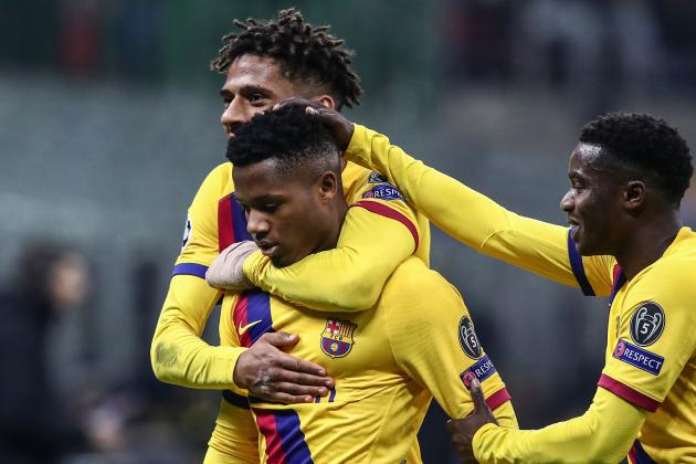 Barcelona´s Guinea-Bissau forward Ansu Fati (L) celebrates with Barcelona's French defender Jean-Clair Todibo (Rear) after scoring  during the UEFA Champions League Group F football match Inter Milan vs Barcelona on December 10, 2019 at the San Siro stadium in Milan. (Photo by Isabella BONOTTO / AFP) (Photo by ISABELLA BONOTTO/AFP via Getty Images)