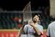 HOUSTON, TEXAS - OCTOBER 30: Anthony Rendon #6 of the Washington Nationals hoists the Commissioners Trophy after defeating the Houston Astros 6-2 in Game Seven to win the 2019 World Series in Game Seven of the 2019 World Series at Minute Maid Park on October 30, 2019 in Houston, Texas. (Photo by Mike Ehrmann/Getty Images)