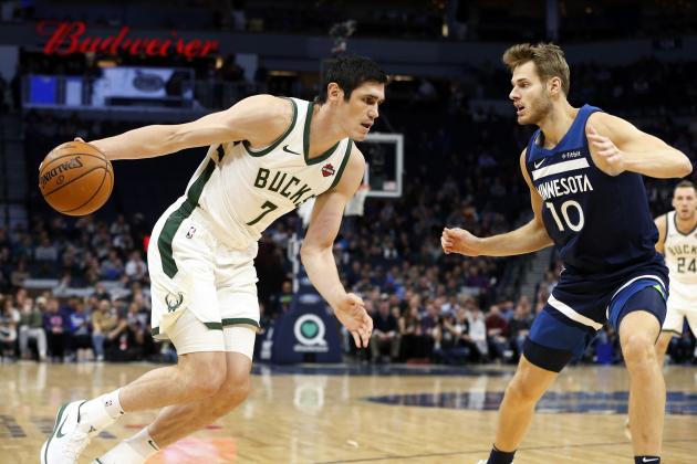 Milwaukee Bucks' Ersan Ilyasova, left, of Turkey, drives as Minnesota Timberwolves' Jake Layman defends in the first half of an NBA basketball game Monday, Nov 4, 2019, in Minneapolis. (AP Photo/Jim Mone)
