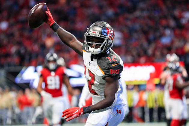 ATLANTA, GA - NOVEMBER 24: Chris Godwin #12 of the Tampa Bay Buccaneers catches a pass for a touchdown in front of Kendall Sheffield #20 of the Atlanta Falcons during the first half at Mercedes-Benz Stadium on November 24, 2019 in Atlanta, Georgia. (Photo by Carmen Mandato/Getty Images)