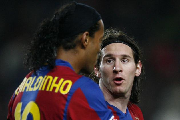Barcelona's Brazilian Ronaldinho (L) talks with Argentinian teammate Leo Messi  during a Spanish League football match against Levante at the Camp Nou stadium in Barcelona on February 24, 2008.  AFP PHOTO/LLUIS GENE (Photo credit should read LLUIS GENE/AFP via Getty Images)