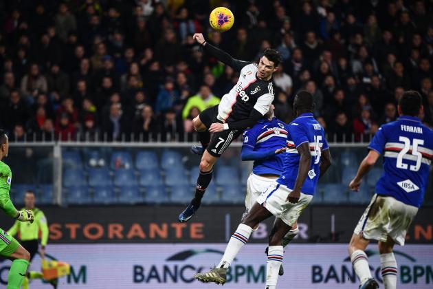 Juventus' Portuguese forward Cristiano Ronaldo (C) scores a header during the Italian Serie A football match Sampdoria vs Juventus on December 18, 2019 at the Luigi-Ferraris stadium in Genoa. (Photo by Marco Bertorello / AFP) (Photo by MARCO BERTORELLO/AFP via Getty Images)