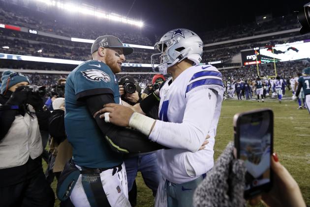 Philadelphia Eagles quarterback Carson Wentz, left, meets with Dallas Cowboys quarterback Dak Prescott after of an NFL football game Sunday, Dec. 22, 2019, in Philadelphia. (AP Photo/Michael Perez)