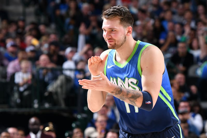 DALLAS, TX - DECEMBER 26: Luka Doncic #77 of the Dallas Mavericks reacts to play against the San Antonio Spurs on December 26, 2019 at the American Airlines Center in Dallas, Texas. NOTE TO USER: User expressly acknowledges and agrees that, by downloading and or using this photograph, User is consenting to the terms and conditions of the Getty Images License Agreement. Mandatory Copyright Notice: Copyright 2019 NBAE (Photo by Glenn James/NBAE via Getty Images)