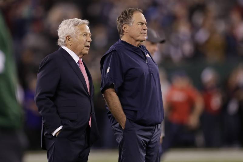 New England Patriots owner Robert Kraft, left, talks to head coach Bill Belichick as their team warms up before an NFL football game against the New York Jets Monday, Oct. 21, 2019, in East Rutherford, N.J. (AP Photo/Adam Hunger)
