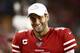 SANTA CLARA, CALIFORNIA - NOVEMBER 24: Jimmy Garoppolo #10 of the San Francisco 49ers smiles on the bench during their game against the Green Bay Packers at Levi's Stadium on November 24, 2019 in Santa Clara, California. (Photo by Ezra Shaw/Getty Images)