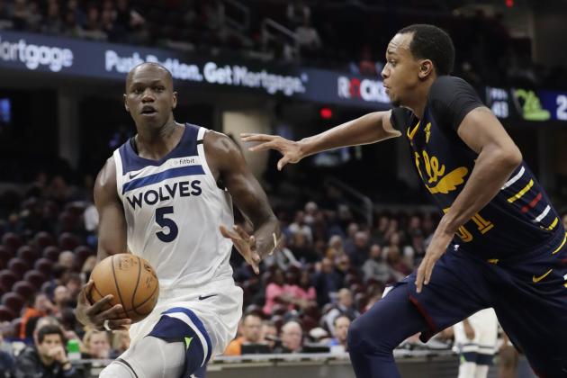 Minnesota Timberwolves' Gorgui Dieng (5) drives against Cleveland Cavaliers' John Henson (31) in the second half of an NBA basketball game, Sunday, Jan. 5, 2020, in Cleveland. Minnesota won 118-103. (AP Photo/Tony Dejak)