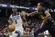 Minnesota Timberwolves' Gorgui Dieng (5) drives against Cleveland Cavaliers' John Henson (31) in the second half of an NBA basketball game, Sunday, Jan. 5, 2020, in Cleveland. Minnesota won 118-103. (AP Photo/Tony Dejak)