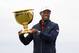 U.S. team player and captain Tiger Woods holds up the trophy after the U.S. team won the President's Cup golf tournament at Royal Melbourne Golf Club in Melbourne, Sunday, Dec. 15, 2019. The U.S. team won the tournament 16-14. (AP Photo/Andy Brownbill)