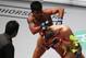 Challenger Rodtang Jitmuangnon, top, of Thailand delivers a barrage of strikes to reigning ONE Flyweight Muay Thai World Champion Jonathan Haggerty, right, of the United Kingdom during their ONE Flyweight World Championship Mixed Martial Arts title fight dubbed 'Dawn of Heroes' Friday, Aug. 2, 2019 at the Mall of Asia Arena in suburban Pasay city south of Manila, Philippines. Rodtang dethroned Haggerty via a unanimous decision. (AP Photo/Bullit Marquez)