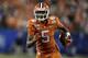 Clemson wide receiver Tee Higgins (5) runs against Virginia during the first half of the Atlantic Coast Conference championship NCAA college football game in Charlotte, N.C., Saturday, Dec. 7, 2019. (AP Photo/Gerry Broome)