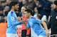 Manchester City's Spanish midfielder David Silva (L) is substituted by Manchester City's English midfielder Phil Foden during the English Premier League football match between Newcastle United and Manchester City at St James' Park in Newcastle-upon-Tyne, north east England on November 30, 2019. (Photo by Lindsey Parnaby / AFP) / RESTRICTED TO EDITORIAL USE. No use with unauthorized audio, video, data, fixture lists, club/league logos or 'live' services. Online in-match use limited to 120 images. An additional 40 images may be used in extra time. No video emulation. Social media in-match use limited to 120 images. An additional 40 images may be used in extra time. No use in betting publications, games or single club/league/player publications. / (Photo by LINDSEY PARNABY/AFP via Getty Images)