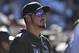 Colorado Rockies third baseman Nolan Arenado (28) looks on from the dugout during a baseball game against the Milwaukee Brewers, Sunday, Sept. 29, 2019, in Denver. (AP Photo/John Leyba)