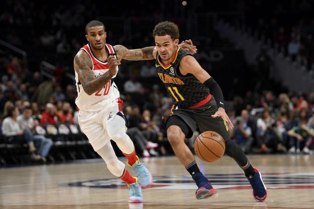 Atlanta Hawks guard Trae Young (11) drives to the basket past Washington Wizards guard Gary Payton II (20) during the first half of an NBA basketball game, Friday, Jan. 10, 2020, in Washington. (AP Photo/Nick Wass)