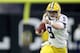 NEW ORLEANS, LOUISIANA - JANUARY 13: Joe Burrow #9 of the LSU Tigers runs the ball against the Clemson Tigers during the College Football Playoff National Championship game at Mercedes Benz Superdome on January 13, 2020 in New Orleans, Louisiana. (Photo by Chris Graythen/Getty Images)