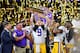 NEW ORLEANS, LOUISIANA - JANUARY 13: Joe Burrow of the LSU Tigers raises the National Championship Trophy with Ed Orgeron, Grant Delpit #7, and Patrick Queen #8 after the College Football Playoff National Championship game at the Mercedes Benz Superdome on January 13, 2020 in New Orleans, Louisiana. The LSU Tigers topped the Clemson Tigers, 42-25. (Photo by Alika Jenner/Getty Images)