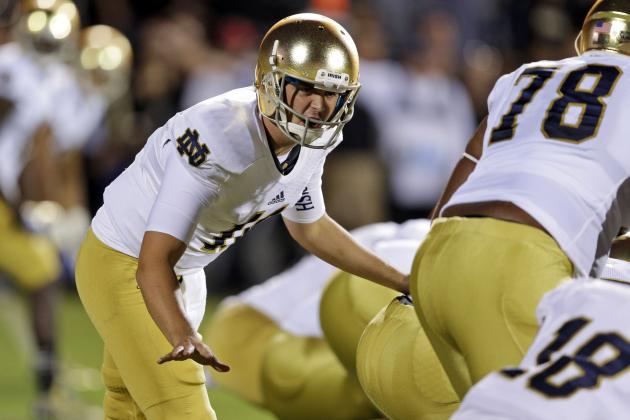 ADVANCE FOR WEEKEND EDITIONS, NOV. 16- 17 - FILE - In this Sept. 14, 2013, file photo, Notre Dame quarterback Tommy Rees calls a play against Purdue during the first half of an NCAA college football game in West Lafayette, Ind. He's been pulled from games for playing poorly, booed loudly and been arrested. But Rees is also a favorite among teammates and will be near the top of several all-time passing lists when it's all said and done. (AP Photo/Michael Conroy, File)