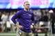 LSU offensive coach Joe Brady watches his team warm up before the first half of the PCA Bowl NCAA college semifinal playoff game between LSU and Oklahoma on Saturday, December 28, 2019, in Atlanta. (Photo AP / Danny Karnik)