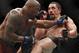 Robert Whittaker, right, and Yoel Romero fight during their middleweight title bout at the UFC 225 mixed martial arts event early Sunday, June 10, 2018, in Chicago. (AP Photo/Jim Young)