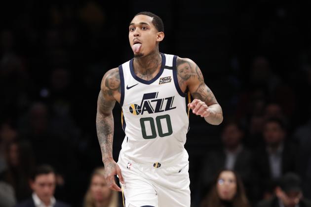 Utah Jazz guard Jordan Clarkson (00) sticks out his tongue after landing a shot despite stiff competition during the second quarter of an NBA basketball game against the Brooklyn Nets, Tuesday, Jan. 14, 2020, in New York. (AP Photo/Kathy Willens)