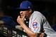 Chicago Cubs first base coach Will Venable looks on from the dugout prior to a baseball game against the Arizona Diamondbacks, Saturday, April 27, 2019, in Phoenix. (AP Photo/Ralph Freso)