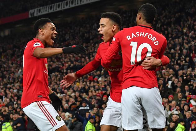 Manchester United's English striker Mason Greenwood (C) celebrates with Manchester United's French striker Anthony Martial (L) and Manchester United's English striker Marcus Rashford (R) after scoring their second goal during the English Premier League football match between Manchester United and Newcastle United at Old Trafford in Manchester, north west England, on December 26, 2019. (Photo by Paul ELLIS / AFP) / RESTRICTED TO EDITORIAL USE. No use with unauthorized audio, video, data, fixture lists, club/league logos or 'live' services. Online in-match use limited to 120 images. An additional 40 images may be used in extra time. No video emulation. Social media in-match use limited to 120 images. An additional 40 images may be used in extra time. No use in betting publications, games or single club/league/player publications. /  (Photo by PAUL ELLIS/AFP via Getty Images)