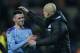 OXFORD, ENGLAND - DECEMBER 18: Phil Foden and Josep Guardiola of Manchester City after their sides 3-1 win during the Carabao Cup Quarter Final match between Oxford United and Manchester City at Kassam Stadium on December 18, 2019 in Oxford, England. (Photo by Robin Jones/Getty Images)