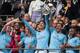 LONDON, ENGLAND - MAY 18: John Stones and Kyle Walker of Manchester City lift FA trophy during the FA Cup Final match between Manchester City and Watford at Wembley Stadium on May 18, 2019 in London, England. (Photo by Sebastian Frej/MB Media/Getty Images)