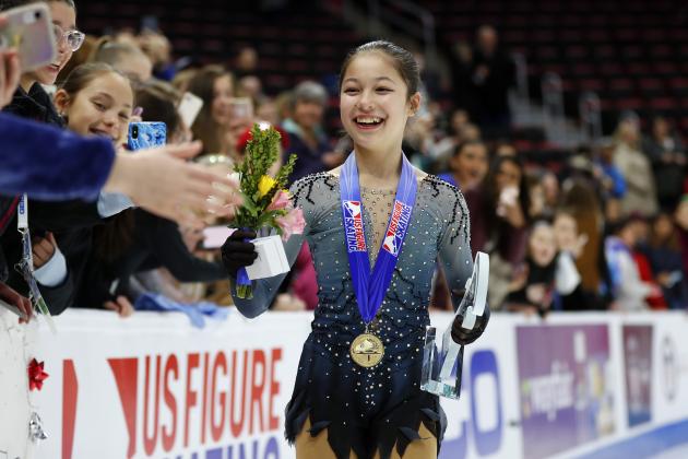 Alysa Liu greets fans while wearing her gold medal after winning the women's title at the U.S. Figure Skating Championships, Friday, Jan. 25, 2019, in Detroit. (AP Photo/Paul Sancya)