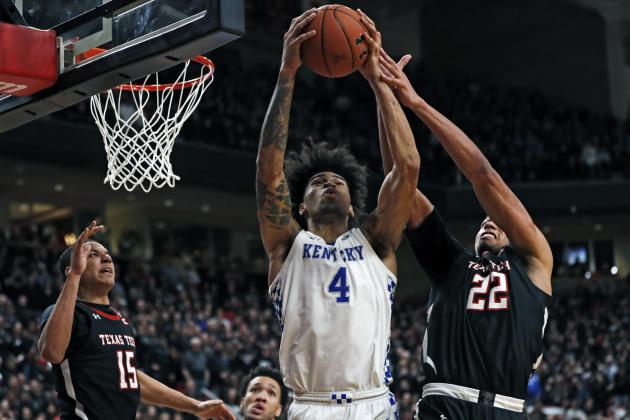 Kentucky's Nick Richards (4) and Texas Tech's TJ Holyfield (22) try to rebound the ball during overtime in an NCAA college basketball game Saturday, Jan. 25, 2020, in Lubbock, Texas. (AP Photo/Brad Tollefson)