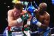 LAS VEGAS, NV - SEPTEMBER 14: (L-R) Floyd Mayweather Jr. throws a right to Canelo Alvarez during their WBC/WBA 154-pound title fight at the MGM Grand Garden Arena on September 14, 2013 in Las Vegas, Nevada. (Photo by Al Bello/Getty Images)