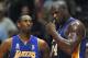 EAST RUTHERFORD, UNITED STATES: Kobe Bryant (L) and Shaquille O'Neal of the Los Angeles Lakers talk during game four of the NBA Finals against the New Jersey Nets at the Continental Airlines Arena 12 June 2002 in East Rutherford, NJ. The Lakers, led by O'Neal, swept to their third straight National Basketball Association championship with a 113-107 victory over the Nets. AFP PHOTO/Matt CAMPBELL (Photo credit should read MATT CAMPBELL/AFP via Getty Images)