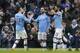 Manchester City's Bernardo Silva, center, celebrates after scoring his side's second goal during an English FA Cup fourth round soccer match between Manchester City and Fulham at the Etihad Stadium in Manchester, England, Sunday, Jan. 26, 2020. (AP Photo/Jon Super)