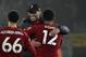 Liverpool's manager Jurgen Klopp, center, celebrates with Liverpool's Trent Alexander-Arnold, left, and Liverpool's Joe Gomez at the end of the English Premier League soccer match between Wolverhampton Wanderers and Liverpool at the Molineux Stadium in Wolverhampton, England, Thursday, Jan. 23, 2020. (AP Photo/Rui Vieira)