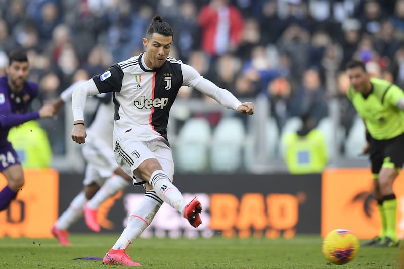 Juventus' Cristiano Ronaldo shoots to score on a penalty during a Serie A soccer match between Juventus and Fiorentina, in Turin, Italy, Sunday, Feb. 2, 2020. (Fabio Ferrari/LaPresse via AP)