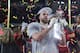 MIAMI, FLORIDA - FEBRUARY 02: Travis Kelce #87 of the Kansas City Chiefs raises the Vince Lombardi Trophy after defeating the San Francisco 49ers 31-20 in Super Bowl LIV at Hard Rock Stadium on February 02, 2020 in Miami, Florida. (Photo by Tom Pennington/Getty Images)