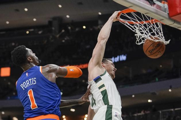 Milwaukee Bucks' Pat Connaughton dunks past New York Knicks' Bobby Portis during the second half of an NBA basketball game Tuesday, Jan. 14, 2020, in Milwaukee. (AP Photo/Morry Gash)
