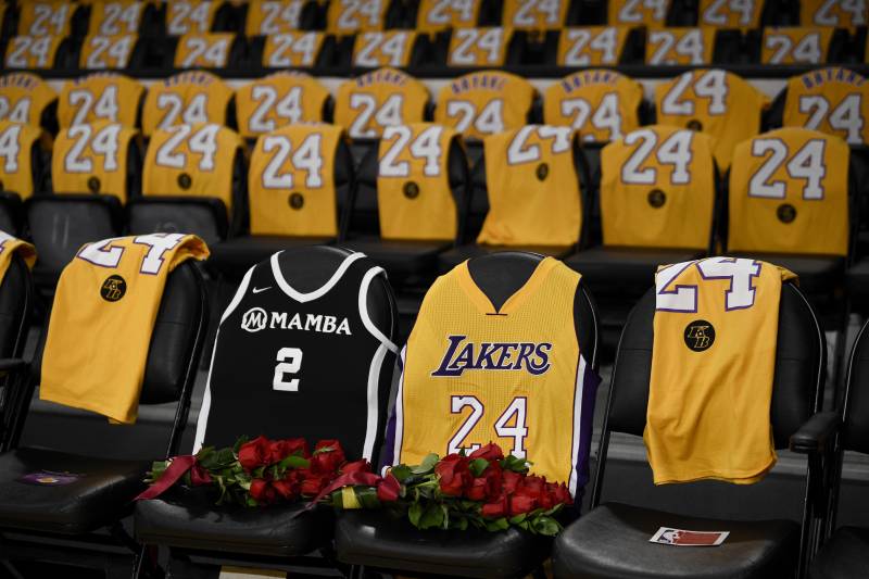 The jerseys of late Los Angeles Laker Kobe Bryant, right, and his daughter Gianna are draped on the seats the two last sat on at Staples Center, prior to the Lakers' NBA basketball game against the Portland Trail Blazers in Los Angeles, Friday, Jan. 31, 2020. The last game two attended was on Dec. 29, 2019 when the Lakers faced the Dallas Mavericks. (AP Photo/Kelvin Kuo)