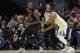 Golden State Warriors forward Andre Iguodala (9) defends Cleveland Cavaliers forward LeBron James (23) in the first half of Game 3 of basketball's NBA Finals, Wednesday, June 6, 2018, in Cleveland. (AP Photo/Tony Dejak)