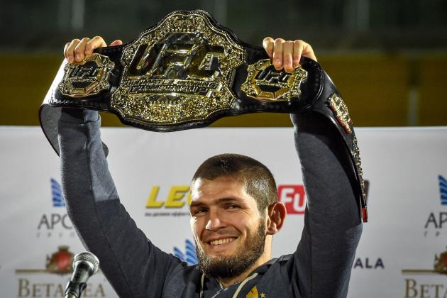UFC lightweight champion Khabib Nurmagomedov of Russia raises his champions belt upon the arrival in Makhachkala on October 8, 2018. - Nurmagomedov defeated Conor McGregor of Ireland in their UFC lightweight championship bout by way of submission during the UFC 229 event inside T-Mobile Arena on October 6, 2018 in Las Vegas, Nevada. (Photo by Vasily MAXIMOV / AFP)        (Photo credit should read VASILY MAXIMOV/AFP via Getty Images)